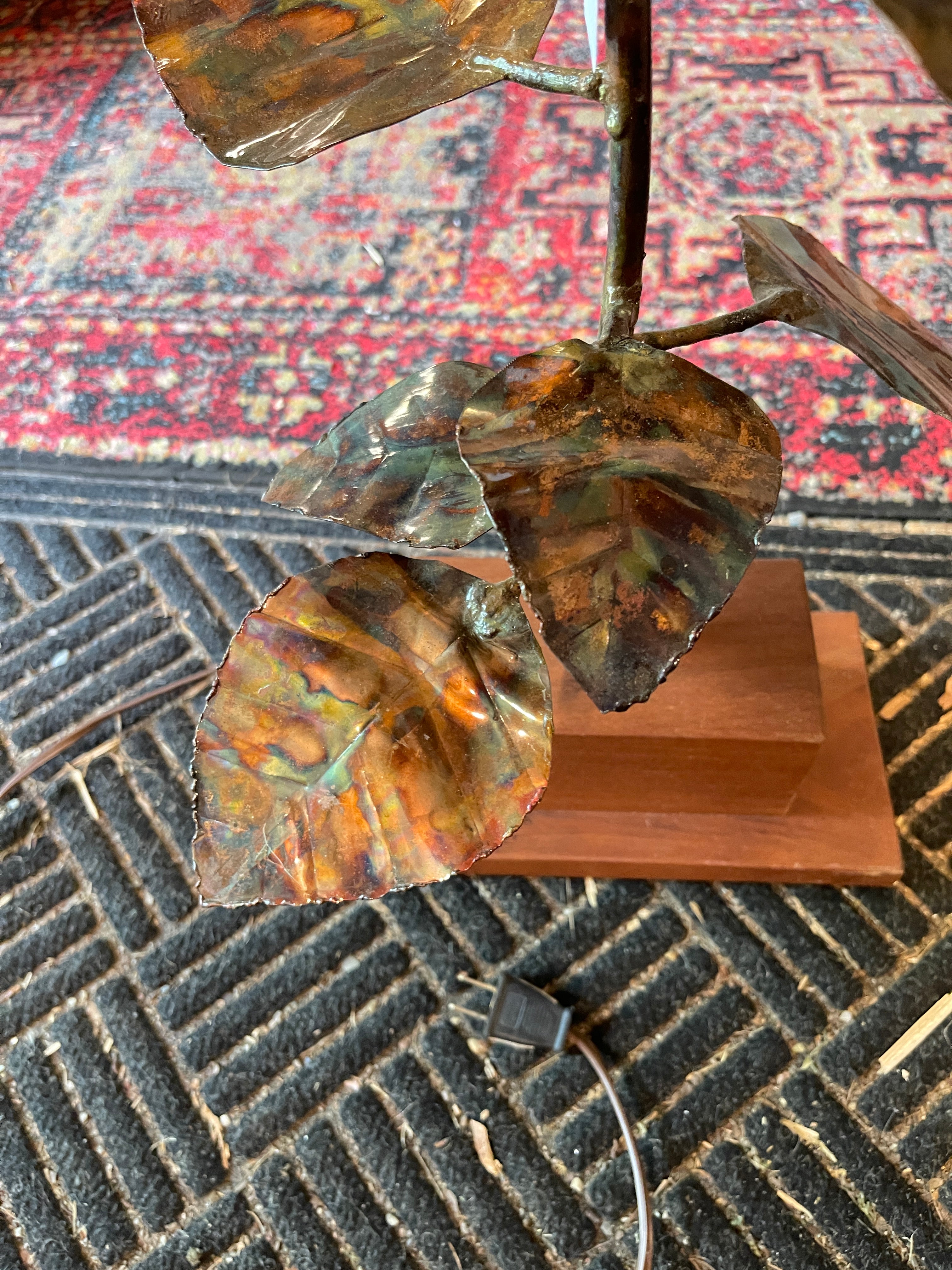 Handcrafted brass and copper sunflower accent light on wooden base