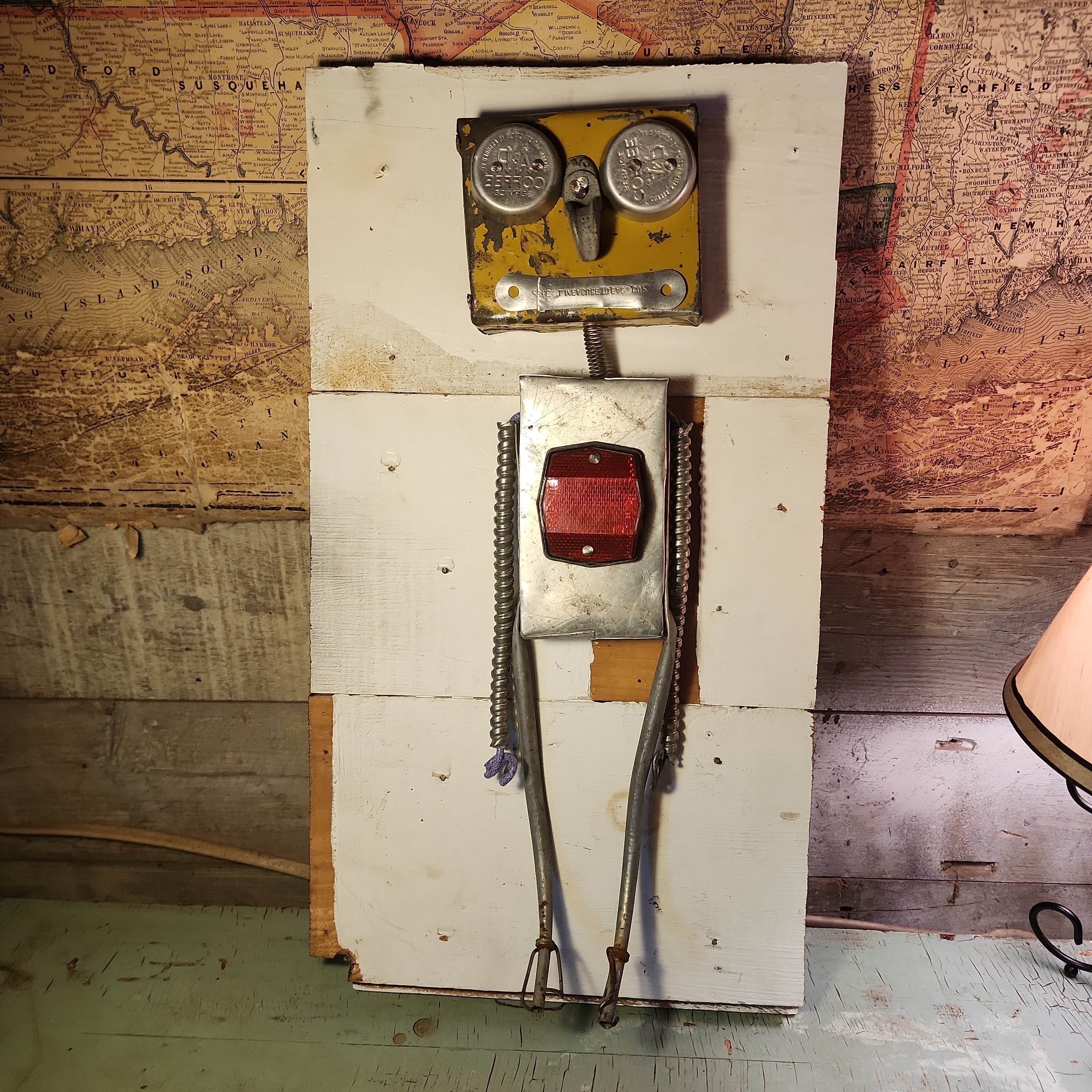 Handcrafted metal robot sculpture made from reclaimed materials