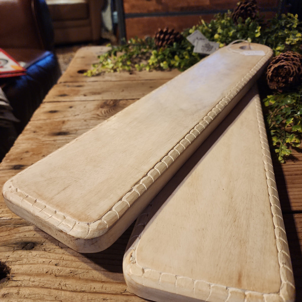 White-washed mango wood serving board displayed on table
