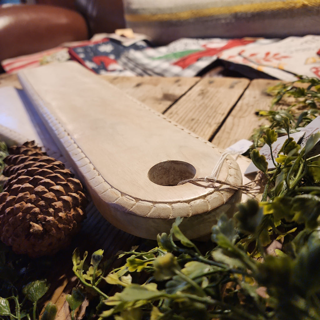 Decorative serving board styled with kitchen items