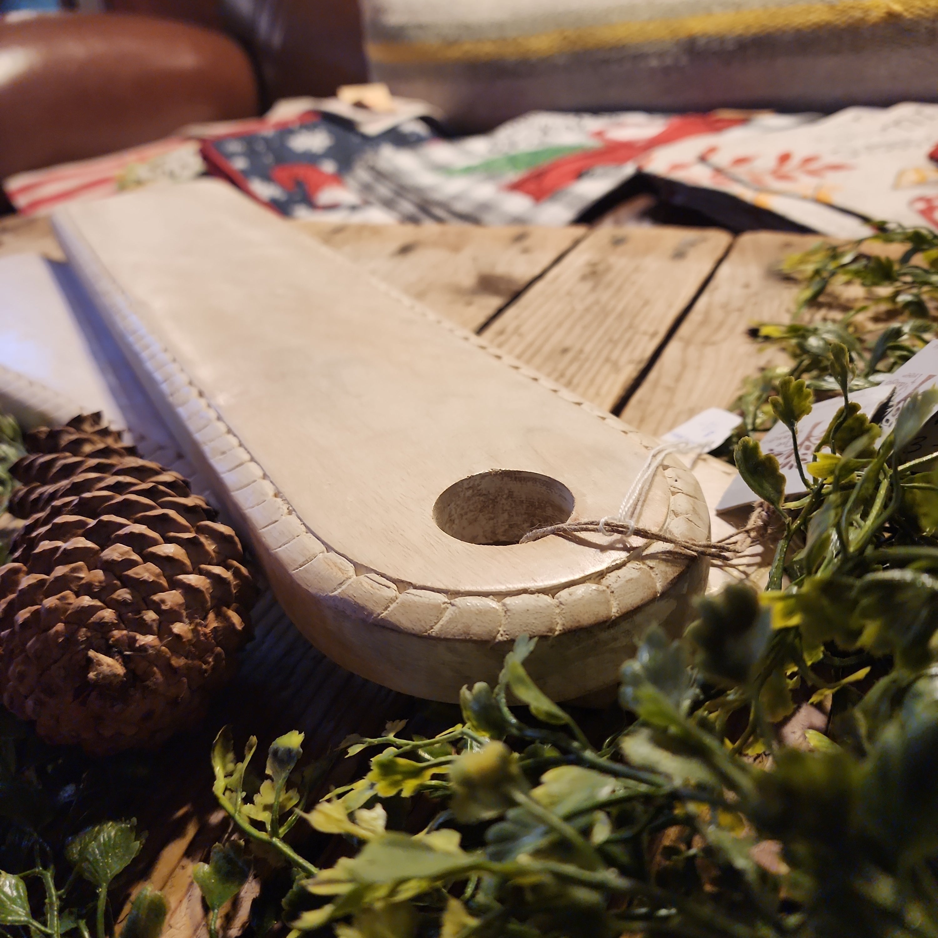 Decorative serving board styled with kitchen items