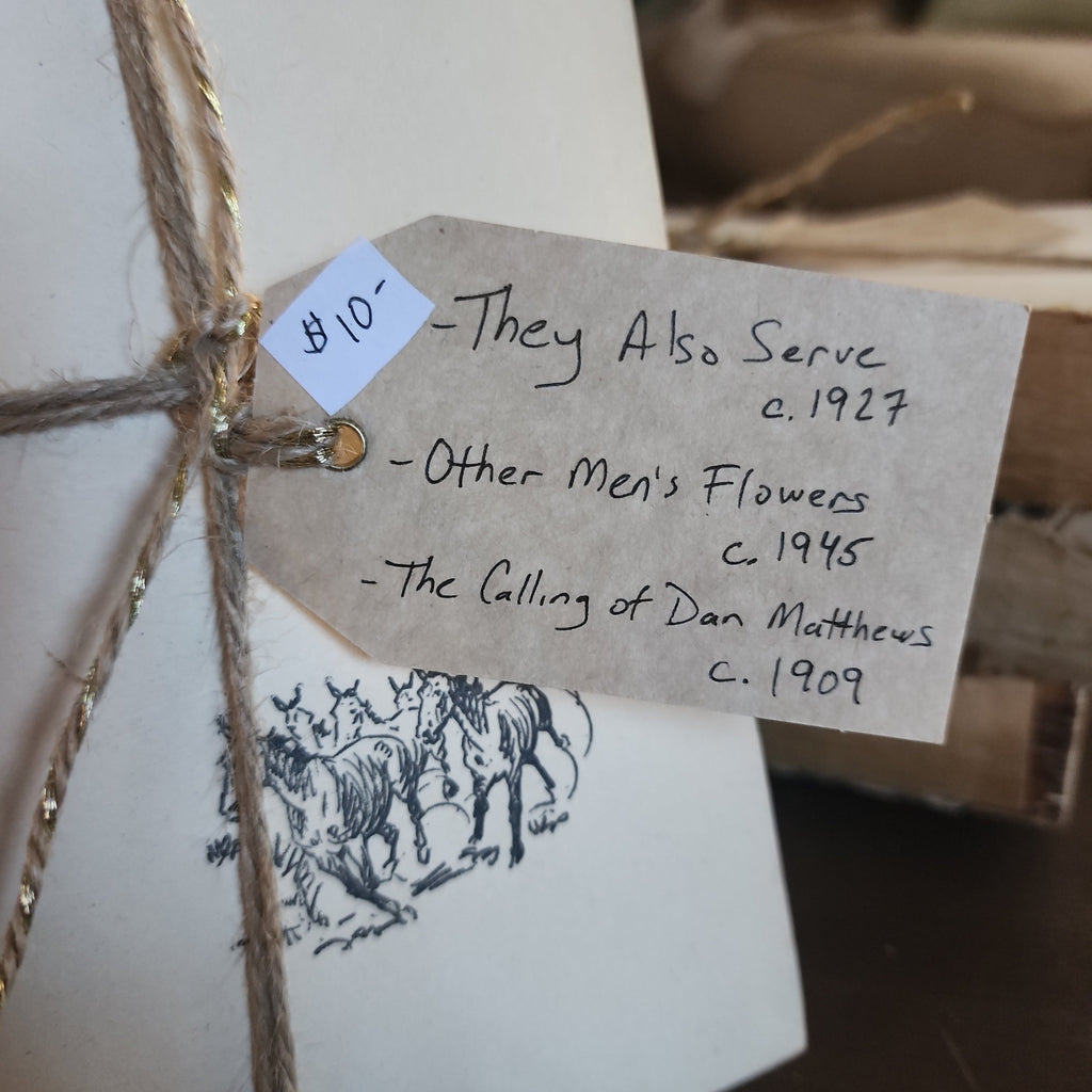 Top view of three vintage books secured with twine | The Olde 1840