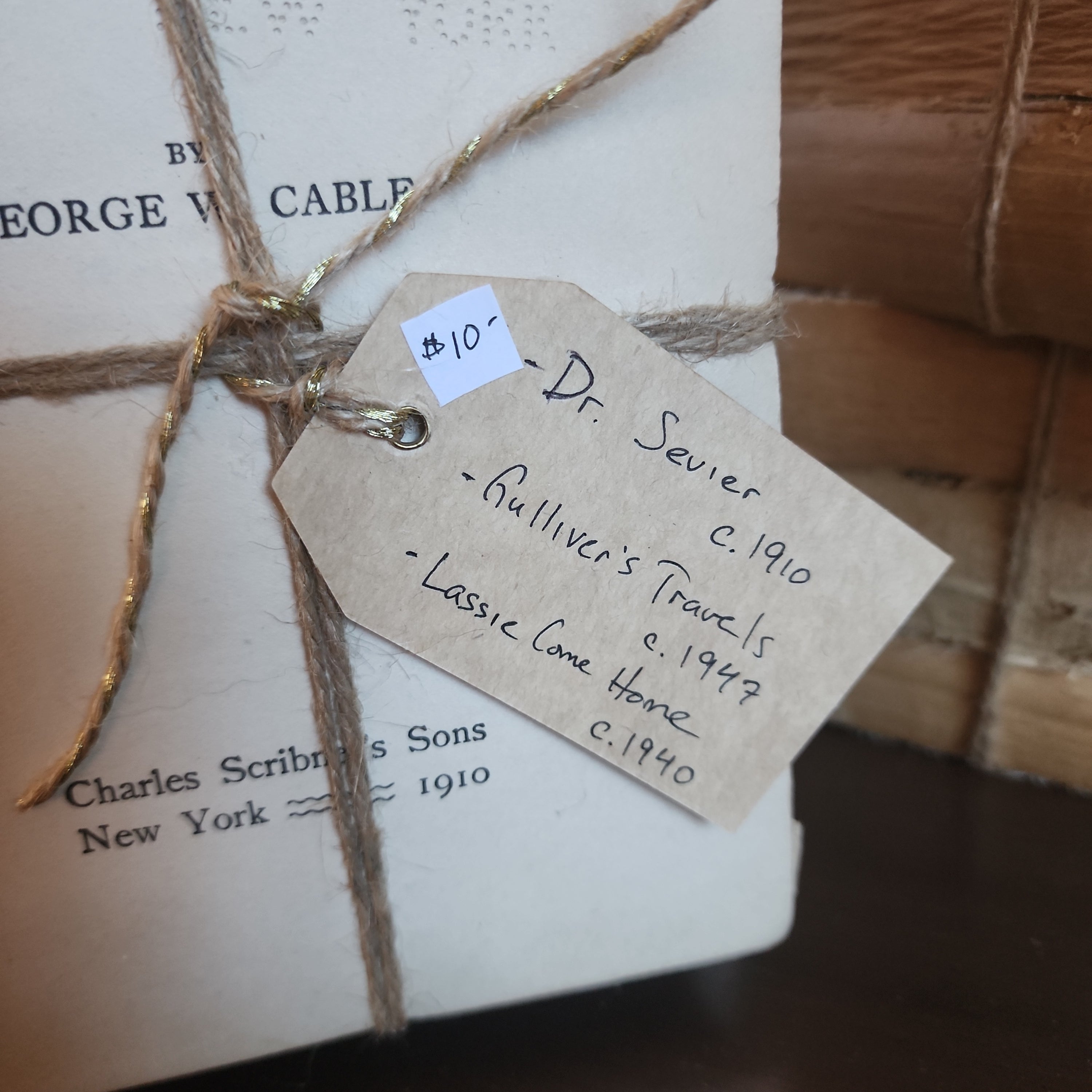 Antique books wrapped neatly with knotted jute string | The Olde 1840