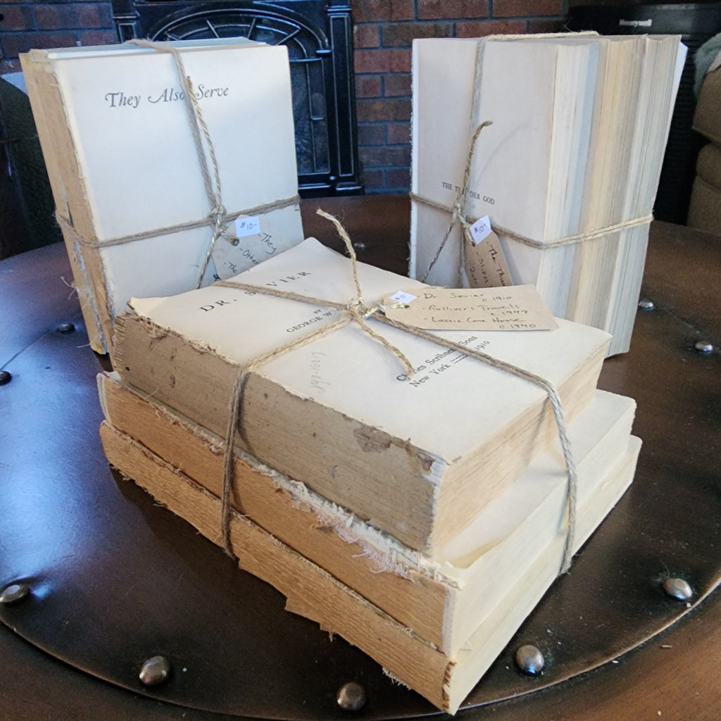 Three antique books with covers removed and twine bow | The Olde 1840