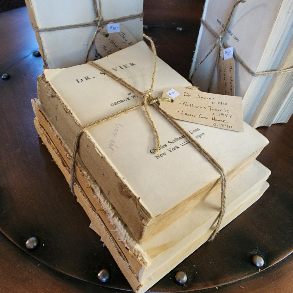 Stack of vintage books tied with natural jute string | The Olde 1840