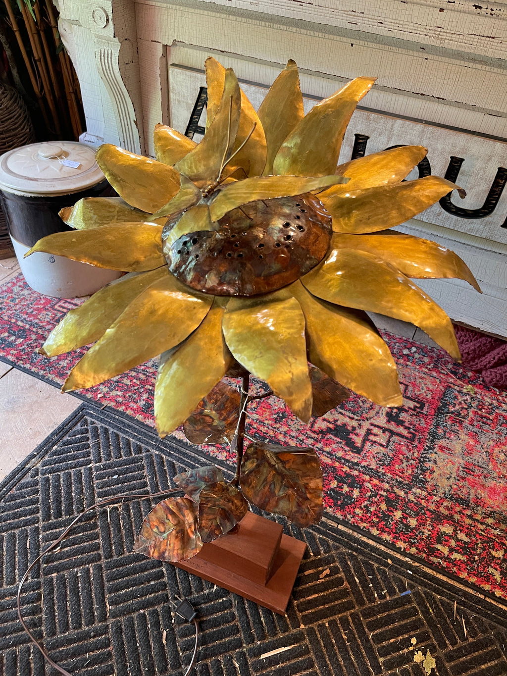 Handcrafted brass and copper sunflower accent light on wooden base