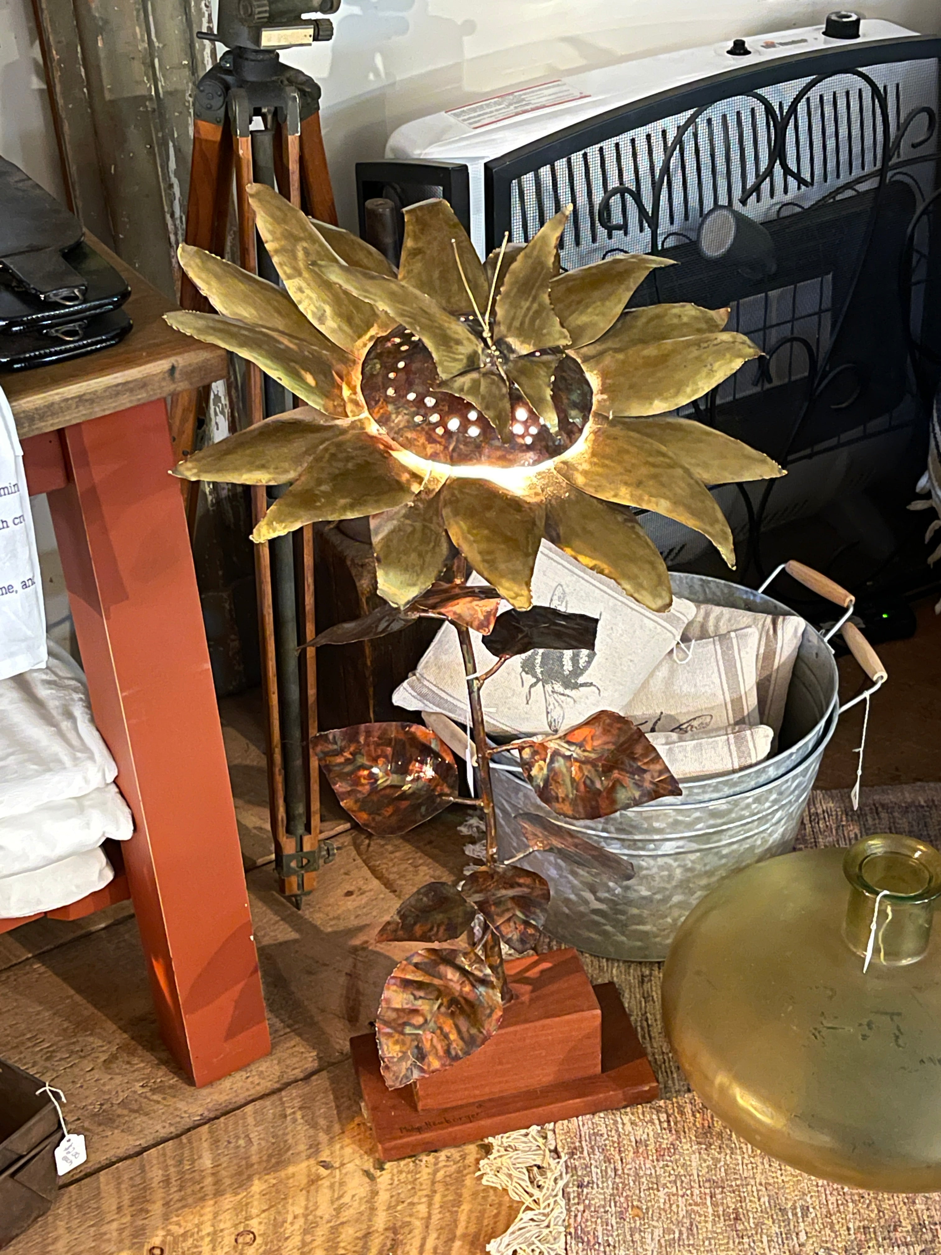 Handcrafted brass and copper sunflower accent light on wooden base