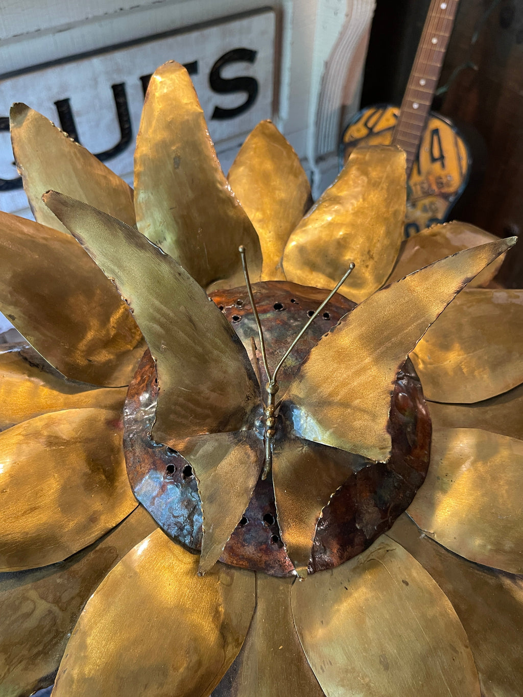 Handcrafted brass and copper sunflower accent light on wooden base